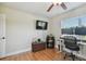 Office or bedroom space with hardwood floors, two monitors, and natural light from window at 3809 N 14Th St, Tampa, FL 33603