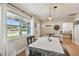 Bright dining room with wood floors, a modern pendant light, and neutral decor at 3809 N 14Th St, Tampa, FL 33603