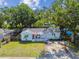 Charming home with well-manicured front lawn, cozy covered porch, and lovely curb appeal at 3809 N 14Th St, Tampa, FL 33603
