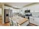 Well-appointed kitchen with a central island, stainless steel appliances, and sleek white cabinetry at 3809 N 14Th St, Tampa, FL 33603