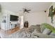 Inviting Living Room with hardwood floors, an entertainment center, and comfortable sectional sofa at 3809 N 14Th St, Tampa, FL 33603