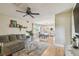 Spacious living room with hardwood floors leading to the dining area, and a comfortable sectional sofa at 3809 N 14Th St, Tampa, FL 33603