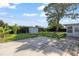 Backyard with patio, shed, lush landscaping, and mature trees at 3901 17Th N Ave, St Petersburg, FL 33713