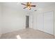 Bedroom features a ceiling fan, closet, and ample natural light at 3901 17Th N Ave, St Petersburg, FL 33713