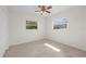 Bright bedroom with two windows and ceiling fan, offering a comfortable space at 3901 17Th N Ave, St Petersburg, FL 33713