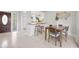 Open-concept dining area featuring a breakfast bar with seating and view into the kitchen at 3901 17Th N Ave, St Petersburg, FL 33713