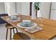 Close-up of a set dining table on a wood-look breakfast bar with seating for two at 3901 17Th N Ave, St Petersburg, FL 33713
