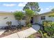 Charming single-story home featuring lush landscaping and a welcoming entrance at 3901 17Th N Ave, St Petersburg, FL 33713