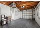 Spacious garage featuring an automatic door, exposed beams, and plenty of room for storage at 3901 17Th N Ave, St Petersburg, FL 33713