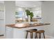 Open concept kitchen offers a breakfast bar with seating and modern appliances at 3901 17Th N Ave, St Petersburg, FL 33713