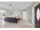 Bright living room with a modern sofa, terrazzo floors, and a stylish entryway at 3901 17Th N Ave, St Petersburg, FL 33713