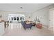 Airy living room featuring terrazzo floors, comfortable seating, and abundant sunlight at 3901 17Th N Ave, St Petersburg, FL 33713