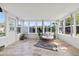 The light-filled sunroom features tile flooring and many windows at 3901 17Th N Ave, St Petersburg, FL 33713