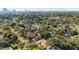 Aerial view of neighborhood with lush greenery and the city skyline in the distance at 4111 W Granada St, Tampa, FL 33629