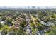 Aerial view of the neighborhood with lush greenery and the city skyline in the distance at 4111 W Granada St, Tampa, FL 33629
