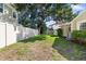 Large backyard featuring a well-maintained lawn, privacy fence, and mature trees at 4111 W Granada St, Tampa, FL 33629
