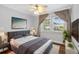 Cozy bedroom with large window, plush bed, and stylish decor at 4111 W Granada St, Tampa, FL 33629