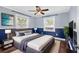 Bedroom featuring two-tone paint, large bed and plush rug at 4111 W Granada St, Tampa, FL 33629