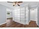 Bonus room with white bookcase, hardwood floors, and natural light at 4111 W Granada St, Tampa, FL 33629