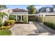 Exterior view of the home with a covered carport and well-manicured landscaping at 4111 W Granada St, Tampa, FL 33629