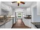 Bright kitchen features all-white cabinetry and modern appliances in a light-filled space at 4111 W Granada St, Tampa, FL 33629
