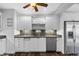 Bright kitchen features stainless steel appliances, granite countertops and white cabinetry at 4111 W Granada St, Tampa, FL 33629