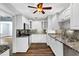 Updated kitchen features stainless steel appliances, granite countertops and new wood floor at 4111 W Granada St, Tampa, FL 33629