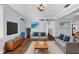 A modern living room with wood floors, comfortable seating, and decor at 4111 W Granada St, Tampa, FL 33629