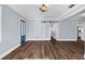 Living room with hardwood floors, light walls and a blue front door at 4111 W Granada St, Tampa, FL 33629