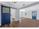 Bright, open floor plan with a decorative barn door, light-colored walls, and tile flooring at 4111 W Granada St, Tampa, FL 33629