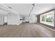 An open-concept space with tile floors, dining area and brick wall at 4111 W Granada St, Tampa, FL 33629