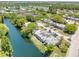 Aerial view of community bordering a canal with lush green landscaping at 4207 Touchton Pl # 4207, New Port Richey, FL 34652