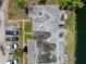 Top-down aerial view of building roof and adjacent parking lot and canal at 4207 Touchton Pl # 4207, New Port Richey, FL 34652