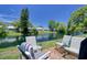 A collection of chairs overlooking a body of water, surrounded by lush greenery at 4207 Touchton Pl # 4207, New Port Richey, FL 34652