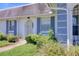 Lovely home featuring a neatly landscaped yard, a stone pathway, and charming blue shutters at 4207 Touchton Pl # 4207, New Port Richey, FL 34652