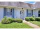 Attractive home with a well-manicured lawn, a stone pathway, and appealing blue shutters at 4207 Touchton Pl # 4207, New Port Richey, FL 34652