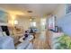 Bright living room with wood floors, comfortable seating, and modern entertainment center at 4207 Touchton Pl # 4207, New Port Richey, FL 34652