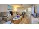 Open concept living room with a view of a TV, furniture and dining area at 4207 Touchton Pl # 4207, New Port Richey, FL 34652
