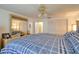 Comfortable main bedroom featuring a large bed, ceiling fan and closet with sliding doors at 4207 Touchton Pl # 4207, New Port Richey, FL 34652
