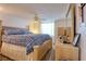 Comfortable main bedroom with a large bed, wood-look floors and ample natural light at 4207 Touchton Pl # 4207, New Port Richey, FL 34652