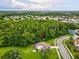 Overhead view of home on lush lot with mature trees creating privacy in a serene neighborhood at 422 Cypress View Dr, Oldsmar, FL 34677