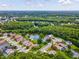 Aerial view of home highlighting its location within a serene neighborhood surrounded by lush green landscape at 422 Cypress View Dr, Oldsmar, FL 34677