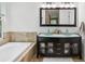 Modern bathroom with double vanity, bathtub and separate shower at 422 Cypress View Dr, Oldsmar, FL 34677