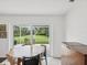 Dining table beside sliding glass doors to the backyard at 422 Cypress View Dr, Oldsmar, FL 34677