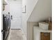 Neutral laundry room featuring washer and dryer, storage baskets, and a convenient utility sink at 422 Cypress View Dr, Oldsmar, FL 34677