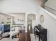 Open-concept living area showcasing hardwood floors, bright natural light, and stylish decor at 422 Cypress View Dr, Oldsmar, FL 34677