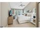 Spacious main bedroom with king bed, TV and access to the outdoor living space at 422 Cypress View Dr, Oldsmar, FL 34677