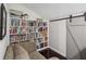 Cozy reading nook with a comfy couch and built-in bookshelves at 422 Cypress View Dr, Oldsmar, FL 34677