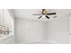 Neutral bedroom with ceiling fan, closet, and a window that offers natural light at 4434 Perch St, Tampa, FL 33617