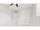 A bedroom with white marble floors, updated closet and modern ceiling fan at 4434 Perch St, Tampa, FL 33617